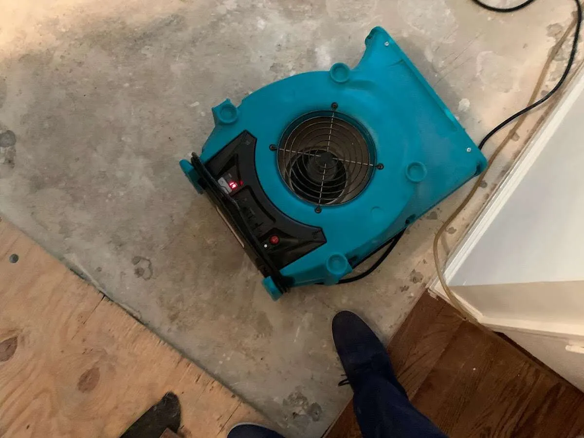 Air mover drying subfloor during Commercial Water Damage Restoration in El Dorado Hills